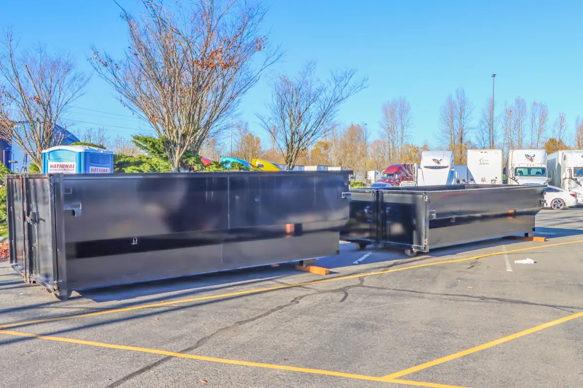 Professional dumpster rental service with roll-off container on residential driveway in Dublin